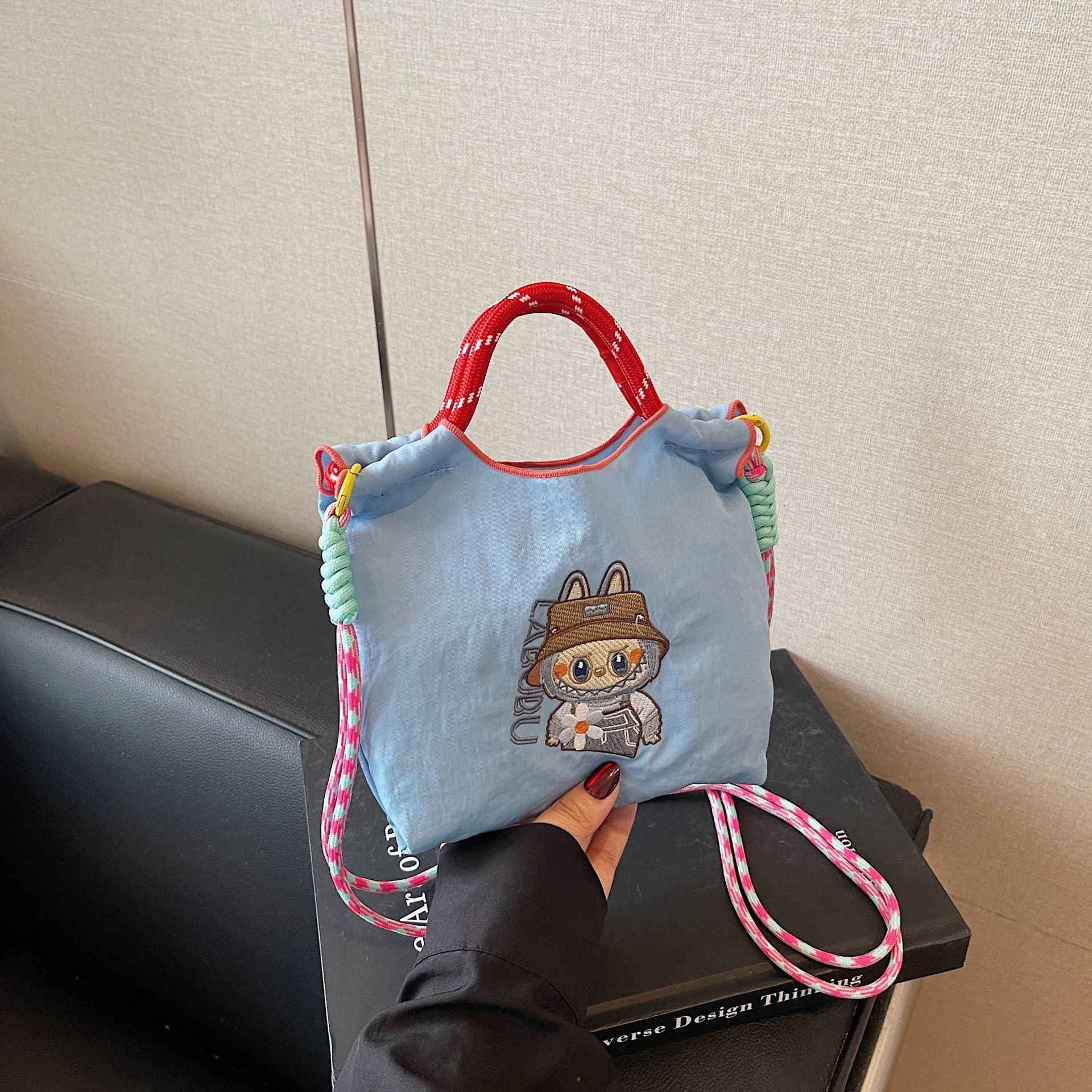 Niche Embroidery Drawstring Messenger Bag