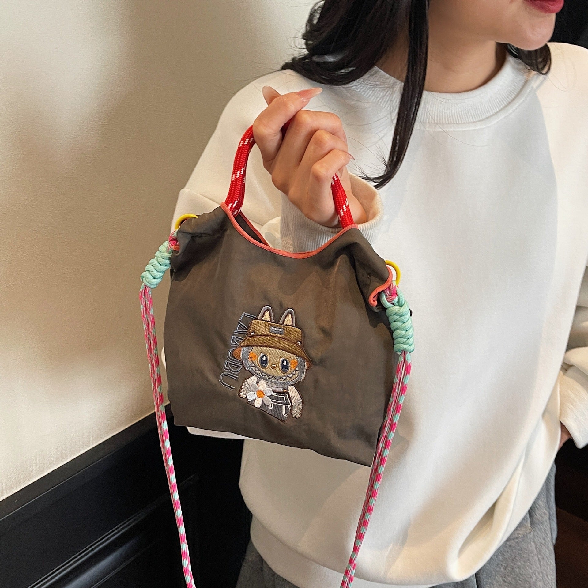 Niche Embroidery Drawstring Messenger Bag